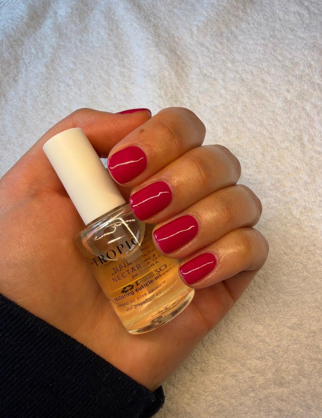 Red gel nails with Tropic nail nectar at 12:47 Beauty